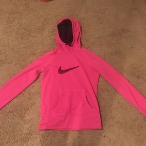A pink nike sweatshirt